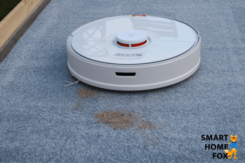The Roborock S7 during the sand suction test on a high-pile carpet
